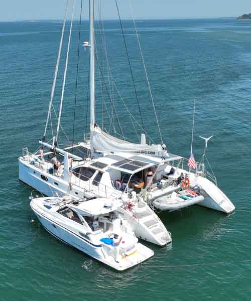 Catana 582 sailing catamaran Valkyrie navigating open ocean waters under full sail during a blue water passage.