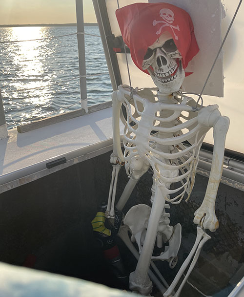 Families enjoying a scenic sightseeing cruise and pirate-themed treasure hunt in the calm waters of Sag Harbor, NY.