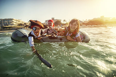 Kids acting like buccaneers during an epic pirate treasure hunt boat charter in Sag Harbor.